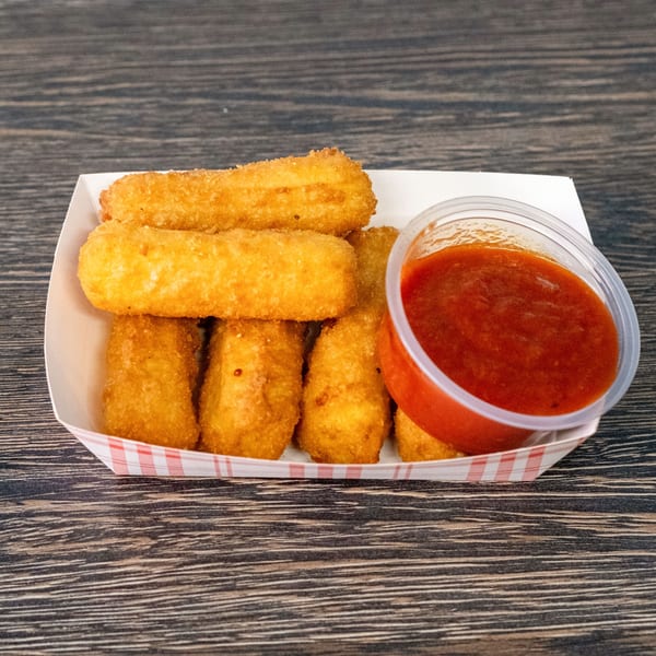 Golden-brown mozzarella sticks in a paper tray with a side of red marinara sauce.